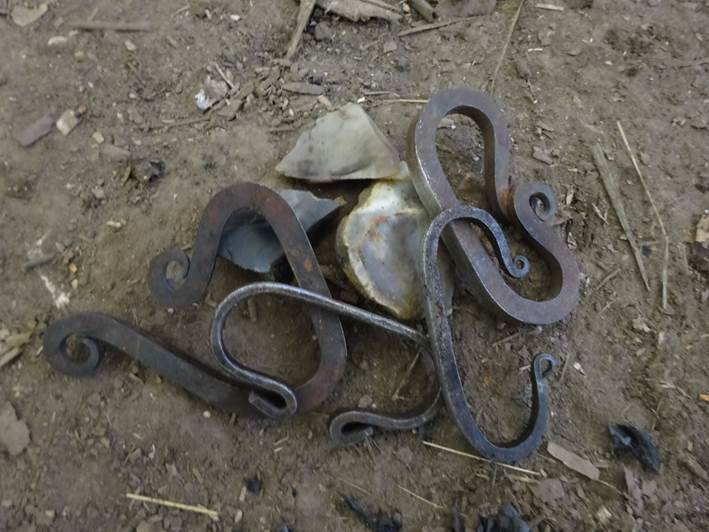 Using a traditional flint and steel to light a fire